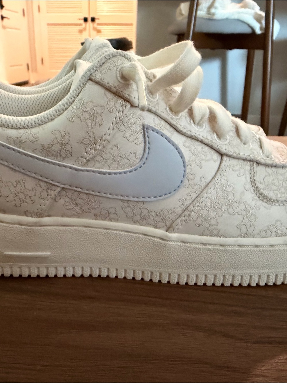 Nike White Low-Top Sneakers with Light Blue Swoosh